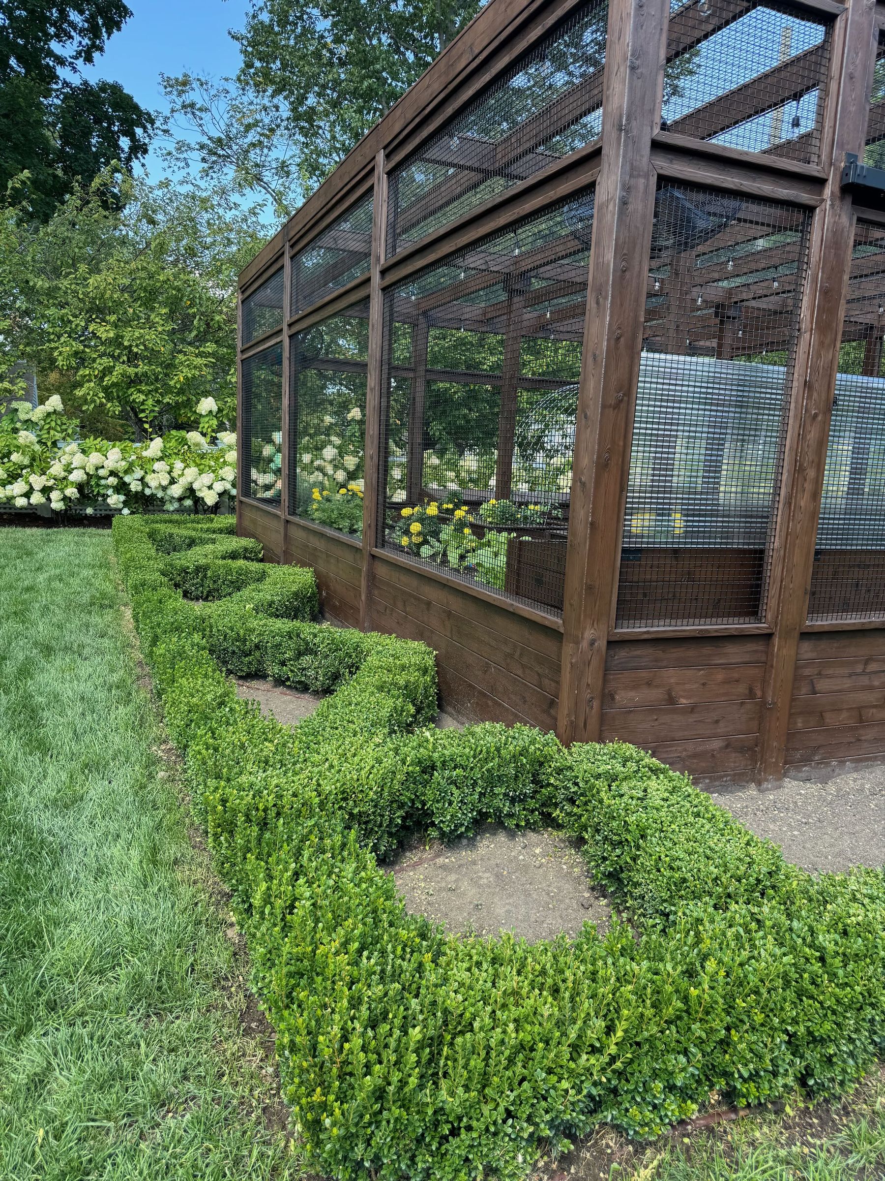 Formal garden with greenhouse