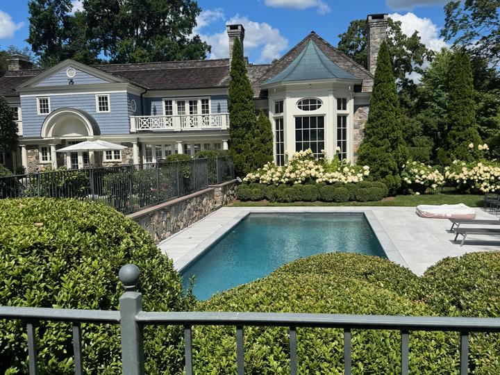 Estate pool with manicured hedges