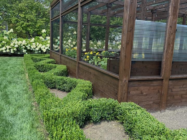 Formal garden with greenhouse